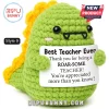Green crochet dinosaur plush holding a sign that reads Best Teacher Ever and Thank you for being a ROAR-SOME TEACHER.!