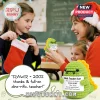 Crocheted green dinosaur toy holding a sign reading Best Teacher Ever, held by a teacher and student in a classroom.!