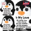 Black and white crocheted penguin plush holding a white sign with text expressing lifelong romantic love.!