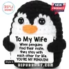 Black and white crocheted penguin plush holding a sign that reads To My Wife with a romantic message about penguin mates.!