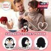 Man and woman knitting with red yarn near three black and white crochet penguin plushies with romantic text cards.!