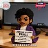Crocheted Prince doll wearing a purple coat and holding a sign reading Emotional Support Prince and purple rain lyrics.!