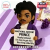 Crocheted Prince doll wearing a purple coat, holding a sign that reads Emotional Support Prince and Dearly beloved text.!