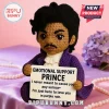 Amigurumi Prince doll wearing a purple coat and holding a sign reading Emotional Support Prince and song lyrics.!