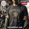 Charcoal grey t-shirt featuring a winged cross graphic, with text Harley, Faith, Family, and Freedom in a garage setting.!