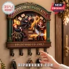 Harry Potter Department of Lost Keys wooden key rack featuring Harry, Ron, and Hermione with wall hooks for keys.