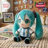 Hatsune Miku plush toy wearing an Argentina number 10 football jersey sitting on a cream cable knit blanket.!