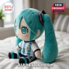 Hatsune Miku plush toy wearing an Argentina national football jersey with number 10, sitting on a white bedspread.!