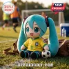 Hatsune Miku plush toy wearing a yellow Brazil national soccer team jersey with number 11 sitting on grass near a ball.!