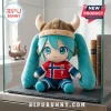 Hatsune Miku plush toy wearing a brown Viking helmet and a red Norway soccer jersey with number 9 on a slate base.!