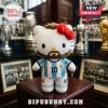 Hello Kitty plush wearing an Argentina soccer jersey with number 10, brown beard, and red bow on a wooden pedestal.!