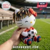 Hello Kitty plush wearing a red Spain soccer jersey, dreadlocks, and a red bow with 19, holding a black and white ball.!