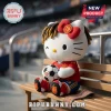 Hello Kitty plush wearing a red Spain soccer jersey, dreadlocks, and a red bow, sitting on a stadium bench with a ball.!
