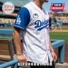 White and blue LA Dodgers baseball jersey featuring Hello Kitty patterns, pink piping, and official team logos.!