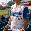 Los Angeles Dodgers baseball jersey featuring Hello Kitty and friends, blue sleeves, and white base with pink piping.!