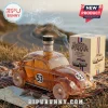 Amber Herbie the Love Bug car-shaped glass decanter with number 53 and a matching 50th-anniversary box outdoors.!