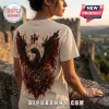 Cream-colored t-shirt featuring a black dragon with red wings, a crown, and a circular emblem on the back.!