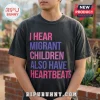 Human Rights Migrant Children Heartbeats T-Shirt in dark grey featuring pink and purple bold text on the chest.
