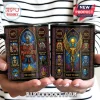 Iron Maiden Stained Glass Eddie Ceramic Mug with colorful band art, song titles, and dates on a black background.