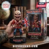 Iron Maiden The Trooper Eddie vinyl figure holding a British flag, standing on a black base next to its illustrated box.!