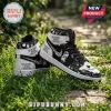 Black and white high-top sneakers featuring Nightmare Before Christmas character prints on green grass.!