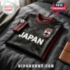 Black Japanese soccer jersey featuring embossed crane and cherry blossom patterns, red collar trim, and Japan crest patch.!