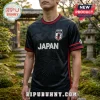 Black Japan national soccer jersey with tonal crane and cherry blossom patterns, red trim, and JFA crest logo.!