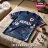 Navy blue Japanese national soccer style jersey with cherry blossom graphics, wave patterns, and flag sleeve patches.!