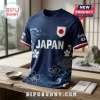 Dark blue Japan national soccer jersey featuring white cherry blossom patterns, wave graphics, and the Japanese flag crest.!