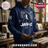 Navy blue cotton-blend hoodie featuring a Jay-Z graphic, Yankees logo, and text dates in a record store setting.!