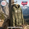 Olive green Jeep 85th anniversary pullover hoodie with vintage graphics hanging on a wooden post in mountain terrain.!