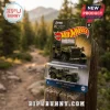 Hot Wheels Jeep 85th anniversary Willys MB die-cast toy in olive green packaging sitting on a wooden post.!