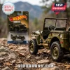 Olive green Willys MB die-cast toy Jeep on rocky ground with matching Hot Wheels 85th Anniversary packaging behind it.!