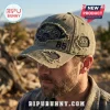 Distressed olive green baseball cap featuring Jeep Heritage embroidery and 85 years text worn by a man outdoors.!