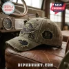 Khaki distressed baseball cap with embroidered off-road vehicle graphic, 85 years text, and 2020 date on leather seat.!