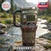 Olive green Jeep-themed stainless steel tumbler with a grille front, winch detail, and Trail Rated badge on a rock surface.!