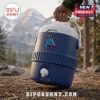 Blue plastic beverage cooler with white handle, spigot, and graphic of a blue bell with a wooden stick on the front.!