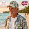 Jimmy Buffett It's 5 O'Clock Somewhere Memorial Cap featuring tropical island graphics on a cream baseball hat.