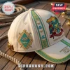 Jimmy Buffett It's 5 O'Clock Somewhere Memorial Cap in cream with parrot, beach emblem, and embroidered nautical patterns.