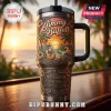 Jimmy Buffett Margaritaville Embossed 40oz Handle Tumbler featuring a tropical beach sunset, guitar, and parrot artwork.