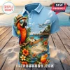 Jimmy Buffett Margaritaville Retired Blue Polo Shirt featuring a parrot in a hat, tropical beach, seaplane, and cocktail.