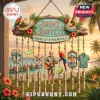 Jimmy Buffett Margaritaville Tropical Metal Wind Chime featuring a wooden sign, guitar, parrot, and gold metal tubes.
