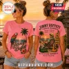 Pink t-shirt with Jimmy Buffett tropical graphics including a macaw, palm trees, and sunset scene on front and back.!