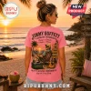 Pink cotton t-shirt featuring Jimmy Buffett graphic with a man in a beach chair, tropical sunset, and ParrotHead cooler.!
