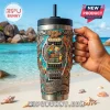 Jimmy Buffett Yeti Tie Dye 40oz Handle Tumbler featuring a guitar, parrot, and Margaritaville text on a beach backdrop.