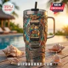 Jimmy Buffett Yeti Tie Dye 40oz Handle Tumbler featuring a tropical parrot, guitar motifs, and island-themed metal relief.