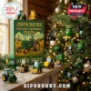 John Deere 2025 advent calendar box with miniature green and yellow tractor ornaments hanging on a Christmas tree.!
