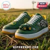 Green leather sneakers featuring a miniature green tractor model, yellow trim, white laces, and gear-shaped side emblems.!