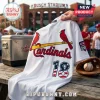 White St. Louis Cardinals baseball jersey with red bird and bat logo, number 18 with USA flag pattern on wooden table.!