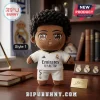 Jude Bellingham Real Madrid plush pillow wearing a white soccer kit with number 5 on a wooden desk with team memorabilia.